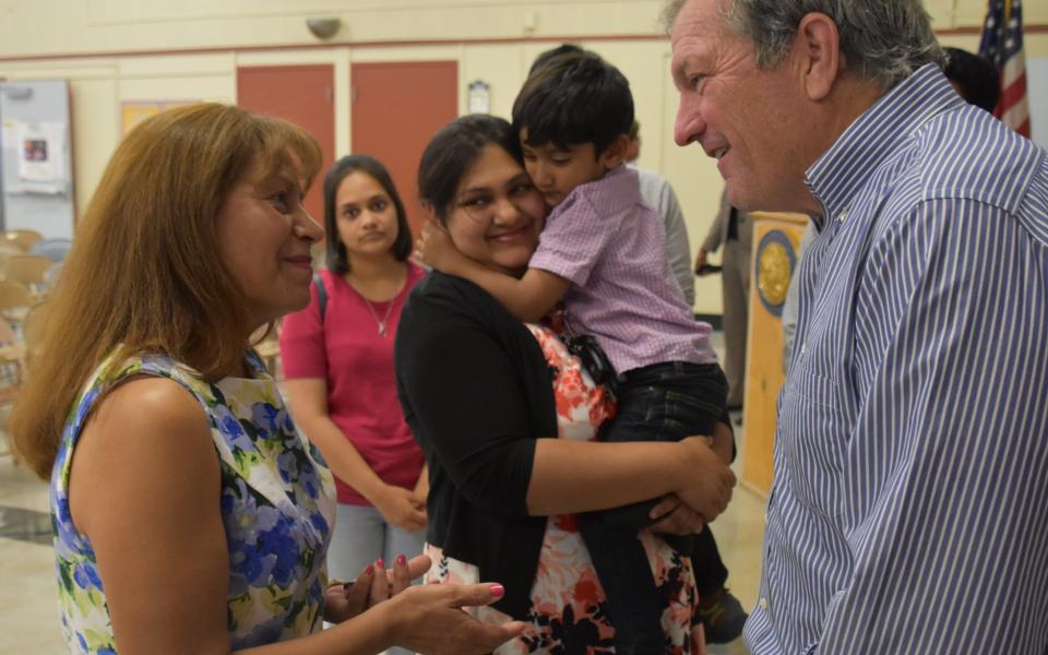 Congressman DeSaulnier talking to constituent